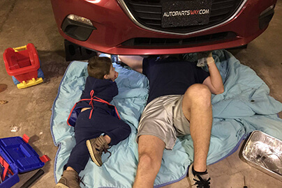 AutoPartsWAY.com customer working on a car